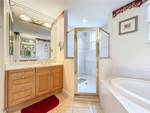 bathroom featuring vanity, independent shower and bath, and tile patterned flooring