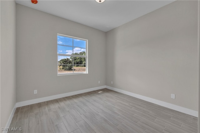 spare room featuring light hardwood / wood-style floors