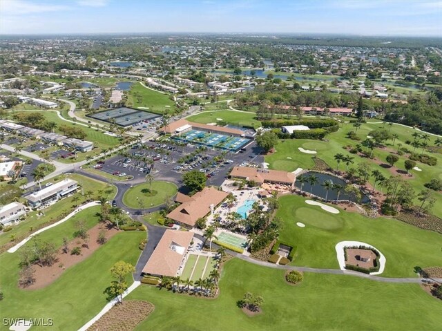 bird's eye view with golf course view and a water view