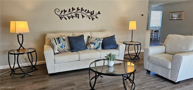 living area with dark wood finished floors and baseboards