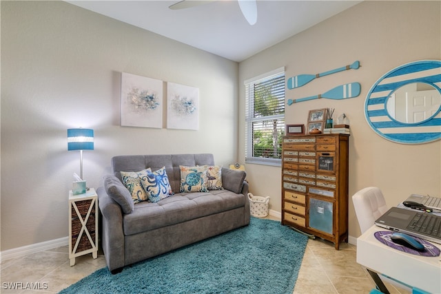 office space with ceiling fan and light tile patterned flooring