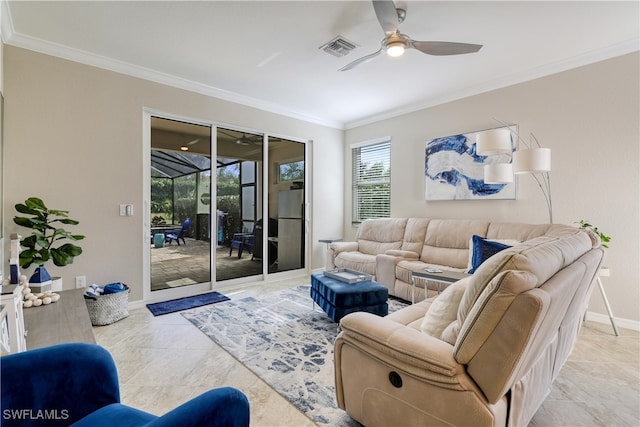 living room featuring ornamental molding, light tile patterned flooring, and ceiling fan