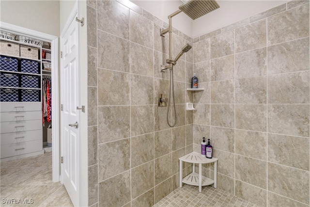 bathroom with a tile shower