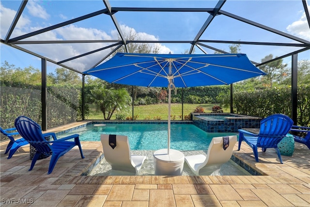 view of pool featuring glass enclosure, a patio area, and an in ground hot tub