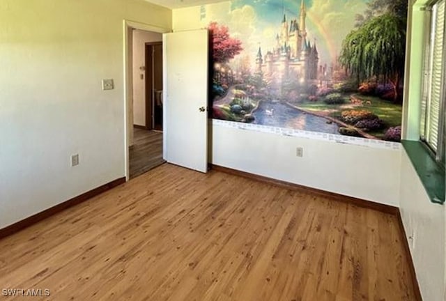 unfurnished room featuring wood-type flooring