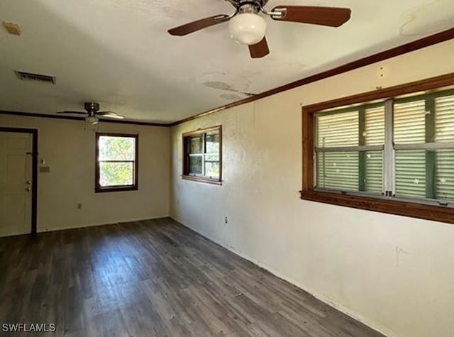 spare room featuring ornamental molding, ceiling fan, and dark hardwood / wood-style flooring