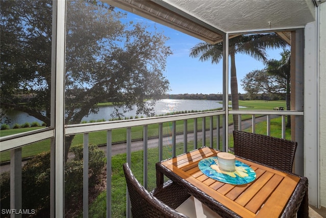 balcony featuring a water view