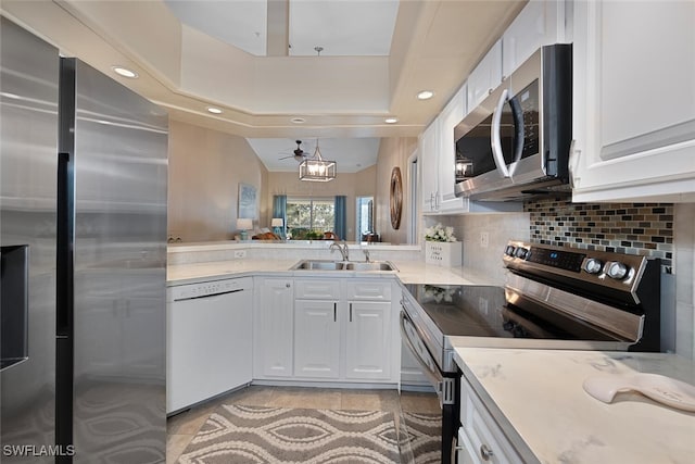 kitchen featuring white cabinetry, stainless steel appliances, and sink