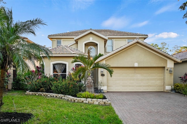 view of front facade with a front lawn and a garage