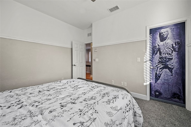 carpeted bedroom with lofted ceiling