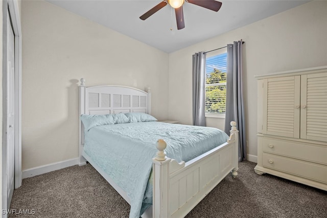 bedroom with ceiling fan, a closet, and dark carpet