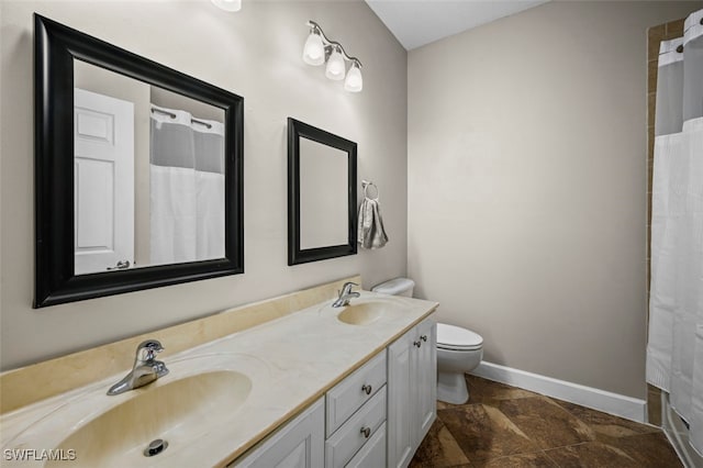 bathroom featuring tile patterned floors, vanity, toilet, and walk in shower