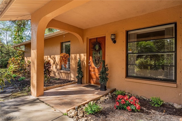 property entrance with a patio