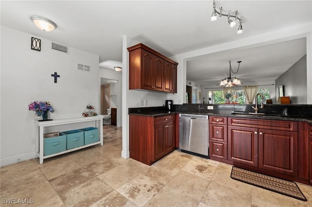 kitchen featuring dishwasher, an inviting chandelier, dark stone counters, and sink