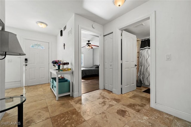 foyer with ceiling fan