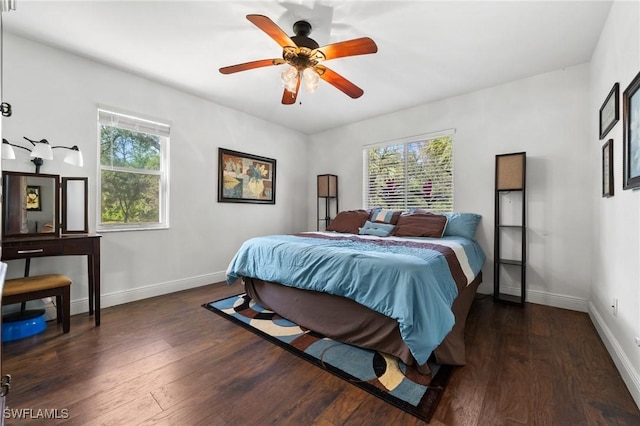 bedroom featuring ceiling fan and dark hardwood / wood-style floors