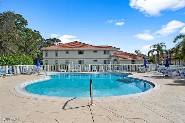 view of swimming pool with a patio