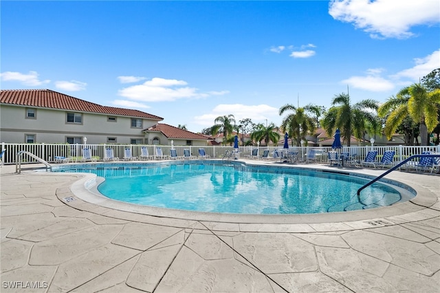 view of swimming pool featuring a patio area