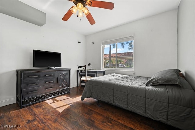 bedroom with ceiling fan and dark wood-type flooring