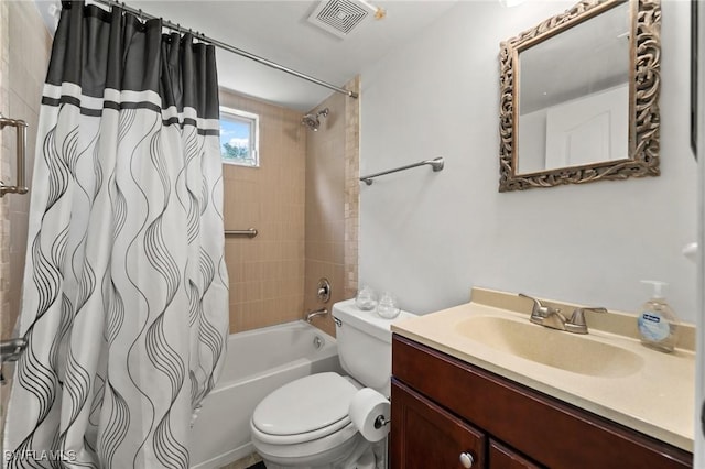 full bathroom with shower / bath combo, vanity, and toilet