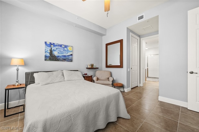 bedroom featuring tile patterned floors and ceiling fan