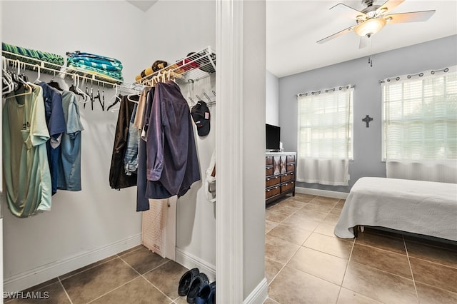 bedroom featuring tile patterned flooring and ceiling fan