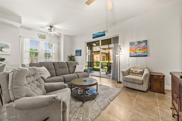 living room featuring light tile patterned flooring and ceiling fan