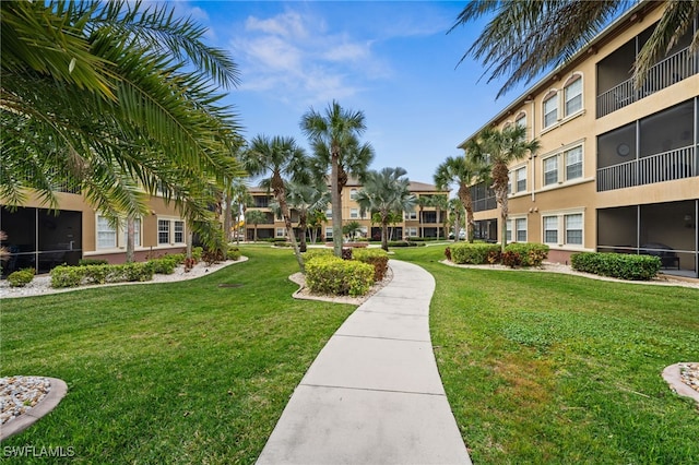 view of home's community with a lawn