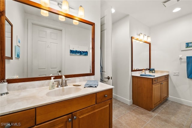 bathroom with vanity and tile patterned floors