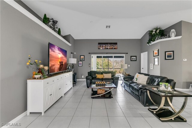 tiled living room with vaulted ceiling