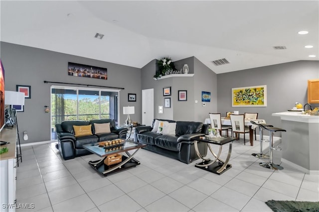 2918 12th St SW, Lehigh Acres, FL 33976 - living room with high vaulted ceiling, light tile patterned floors, and recessed lighting