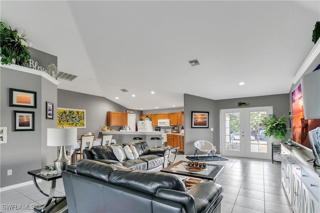 2918 12th St SW, Lehigh Acres, FL 33976 - living room featuring french doors, light tile patterned floors, and recessed lighting
