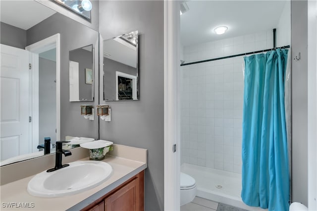 bathroom featuring vanity, a shower with curtain, toilet, and tile patterned flooring