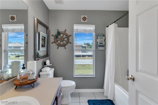 full bathroom with vanity, toilet, shower / bathtub combination with curtain, and a wealth of natural light