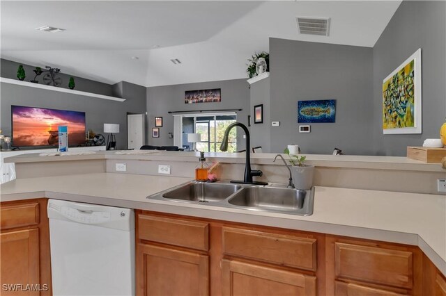 2918 12th St SW, Lehigh Acres, FL 33976 - kitchen with white dishwasher, light countertops, open floor plan, and vaulted ceiling