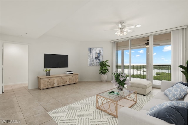 tiled living room featuring ceiling fan