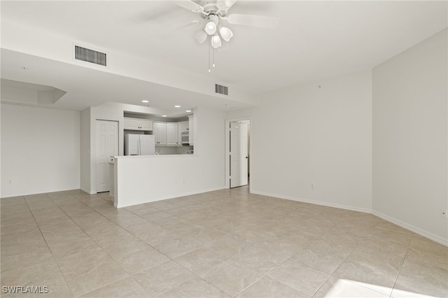 1001 Arbor Lake Dr Unit 1003, Naples, FL 34110 - unfurnished living room featuring ceiling fan, light tile patterned flooring, recessed lighting, and baseboards
