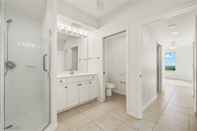1001 Arbor Lake Dr Unit 1003, Naples, FL 34110 - bathroom with a ceiling fan, tile patterned flooring, a stall shower, and toilet