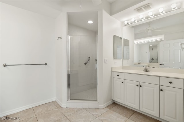 1001 Arbor Lake Dr Unit 1003, Naples, FL 34110 - full bathroom with a ceiling fan, a shower stall, baseboards, and tile patterned flooring