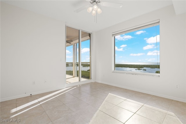 1001 Arbor Lake Dr Unit 1003, Naples, FL 34110 - tiled empty room with a ceiling fan and baseboards