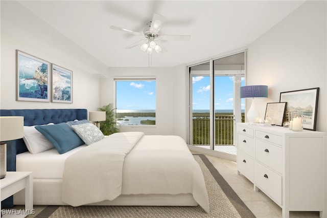 tiled bedroom with access to outside and ceiling fan