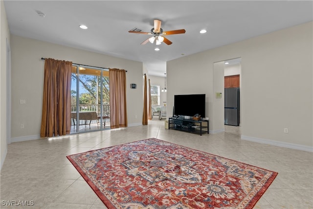 tiled living room with ceiling fan