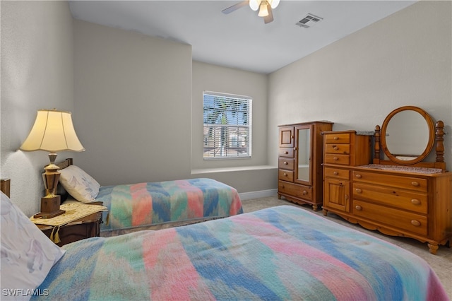 bedroom featuring light carpet and ceiling fan