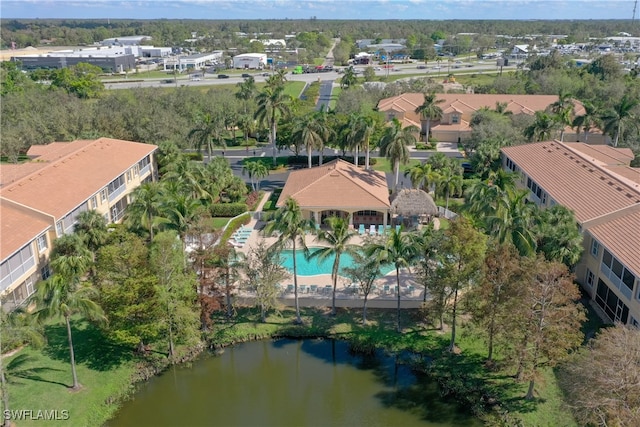 birds eye view of property with a water view