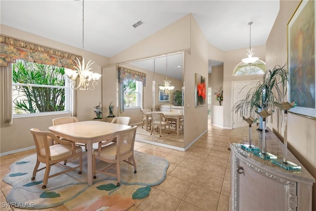 dining space with light tile patterned floors, vaulted ceiling, and a notable chandelier