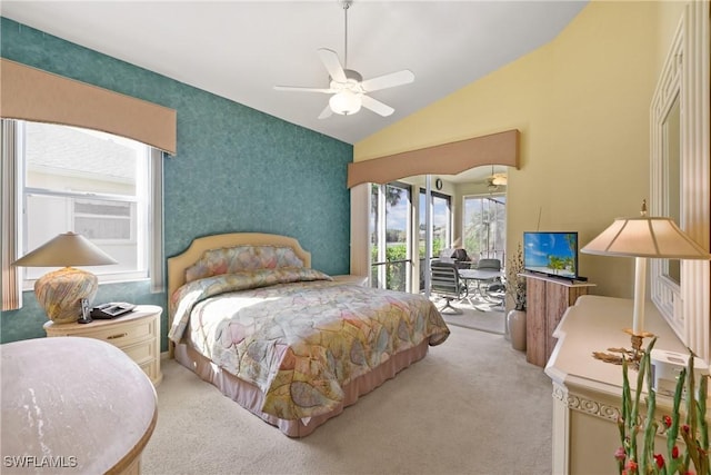 carpeted bedroom featuring access to outside, ceiling fan, and lofted ceiling