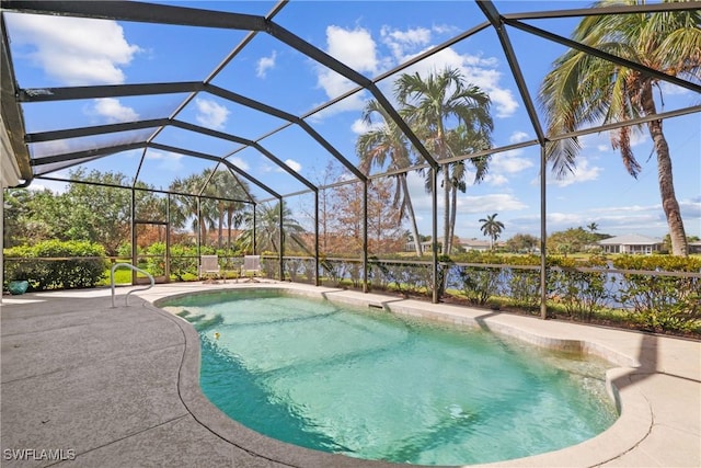 view of pool with a lanai, a water view, and a patio