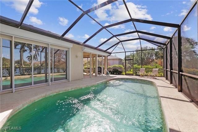 view of pool featuring a lanai and a patio area