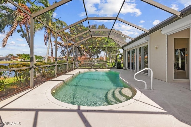 view of pool featuring a patio and a lanai