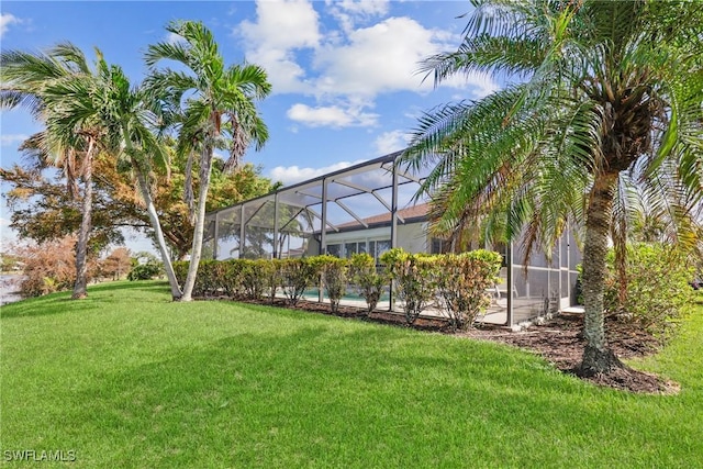 view of yard featuring a lanai